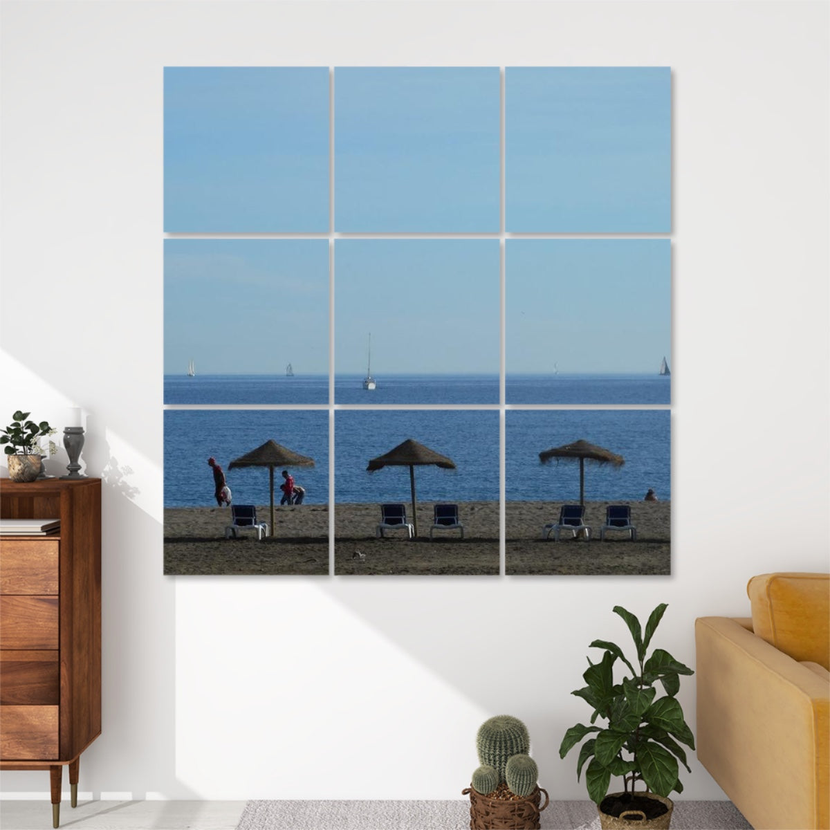 Full color beach scene featuring straw parasols, lounge chairs, people walking, and distant sailboats, split across 9 decorative acoustic panels.