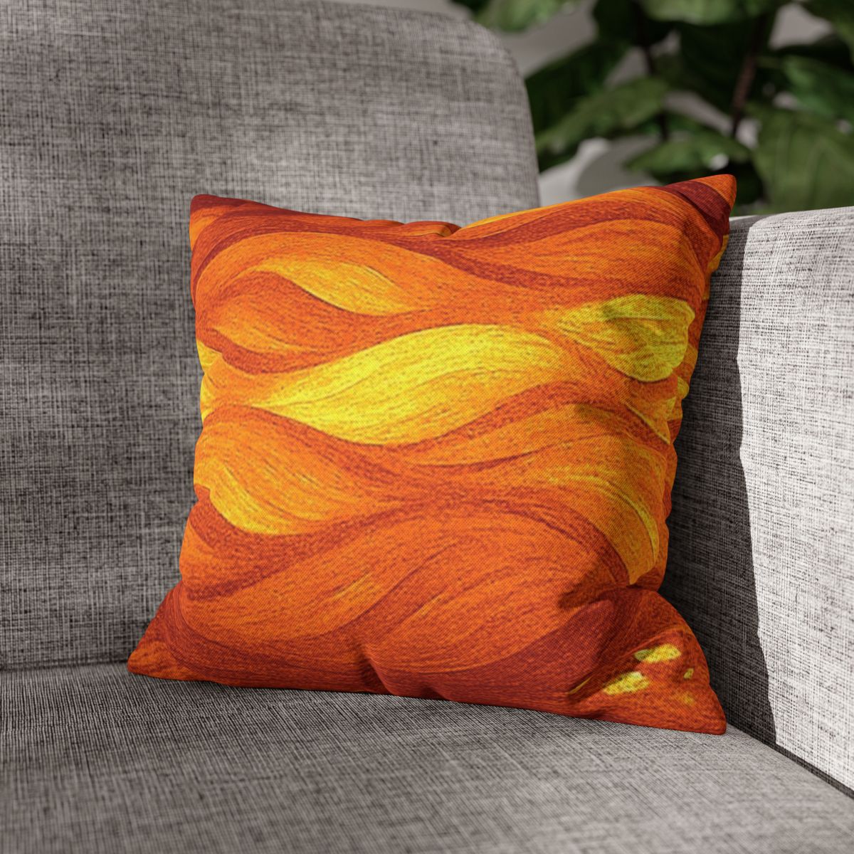 14" × 14" Abstract Wave pillowcase in Orange-Amber placed in the corner of a gray sofa