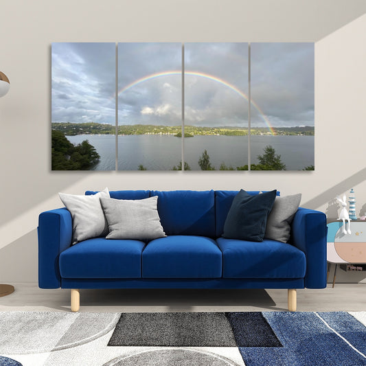 4 Decorative Sound Absorbing Panels Featuring Rainbow in Stormy Sky. Four panel lake scene over blue sofa for room acoustics