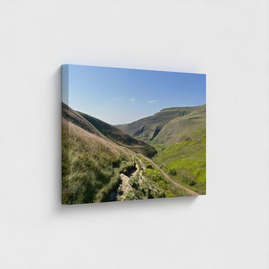 Side angle of square recycled canvas with bright Peak District landscape, grassy slopes and a clear sky in natural light