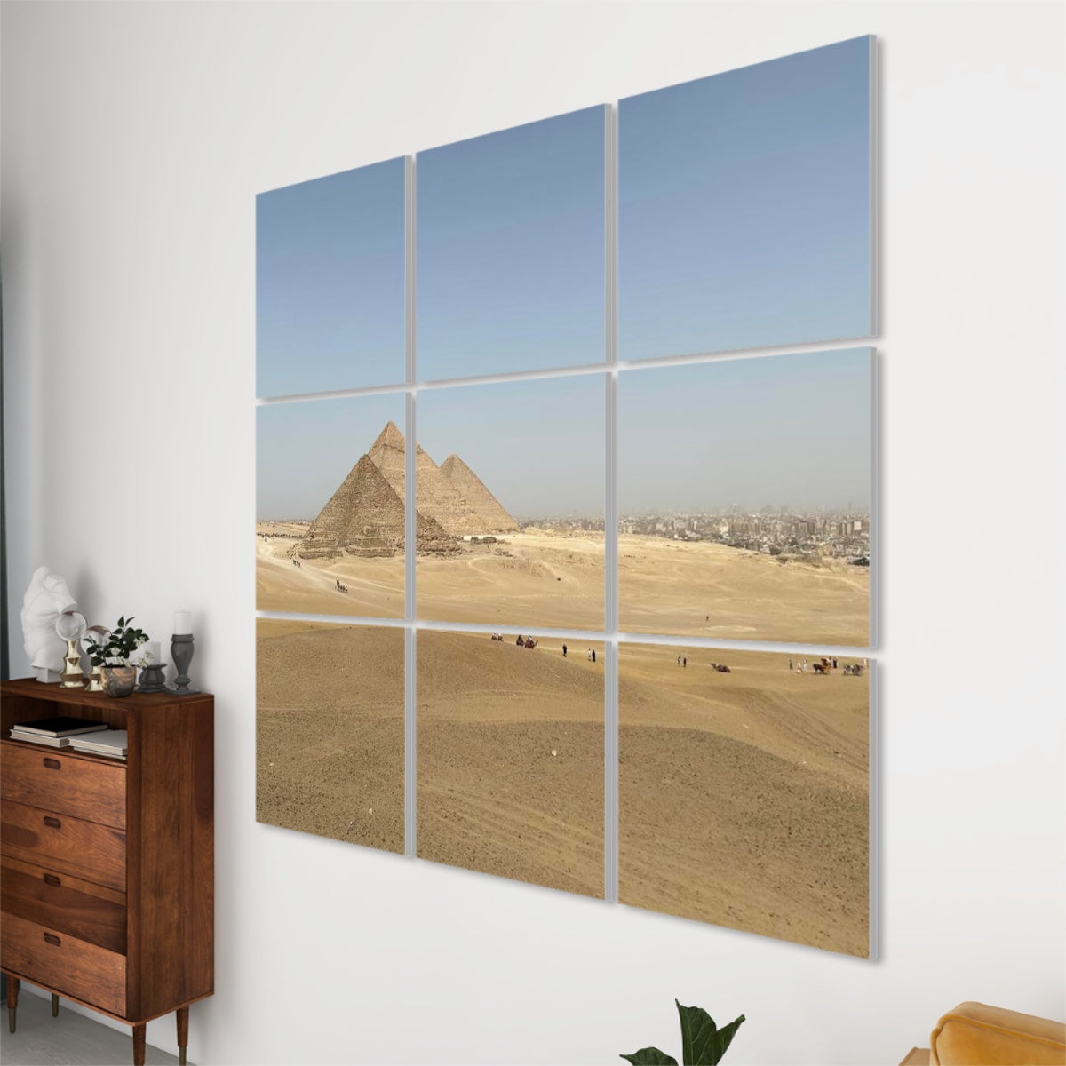 Right-side perspective of the Distant Pyramids wall panels, highlighting depth, alignment, and rich desert tones under a blue sky.