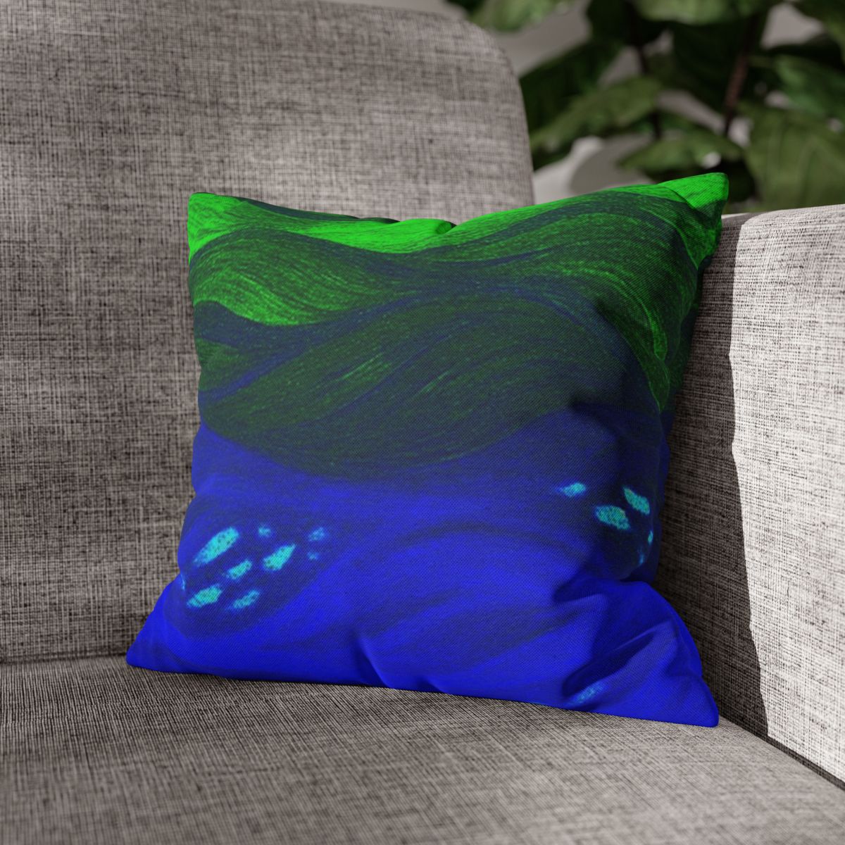 14" × 14" Abstract Wave pillowcase in Verdant Azure placed in the corner of a gray sofa