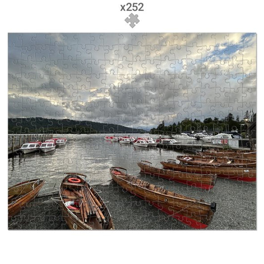 Made in UK Windermere Boats Sustainable Jigsaw Puzzle featuring wooden boats on lake under cloudy sky