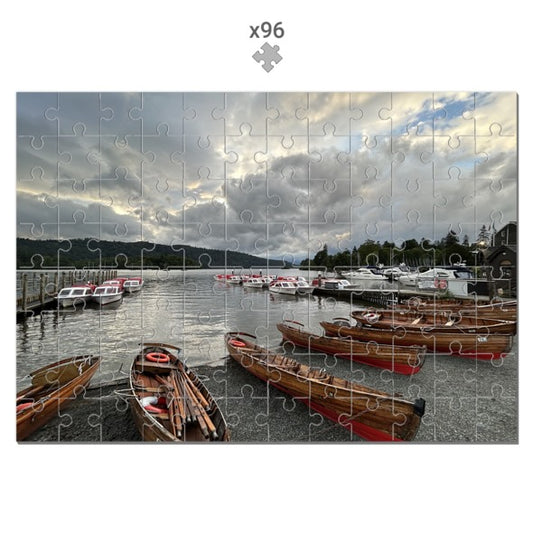 Made in UK Windermere Boats Sustainable Jigsaw Puzzle showing wooden boats docked on lake under cloudy sky