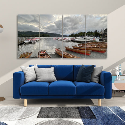 Lake District 4 Decorative Sound Absorbing Wall Panels showing a lake with wooden boats displayed above a blue sofa