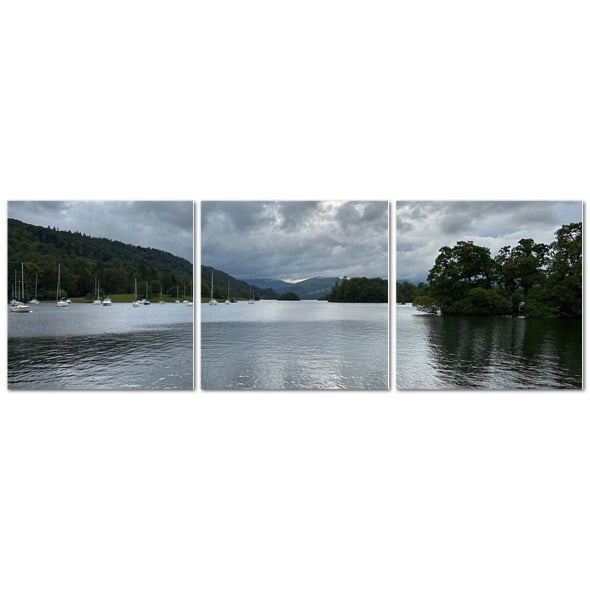 Windermere Lake Landscape Made in UK Triptych Canvas showing wooden rowboats and motorboats at a cloudy lakeside pier