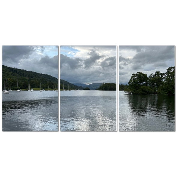 Windermere Lake Landscape Made in UK Triptych Canvas showing wooden boats and dock under dramatic cloudy sky