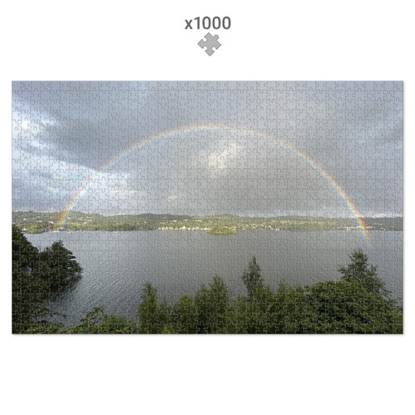Landscape with Lake and Rainbow Jigsaw Puzzle featuring a scenic lake under a cloudy sky with a vibrant rainbow arch