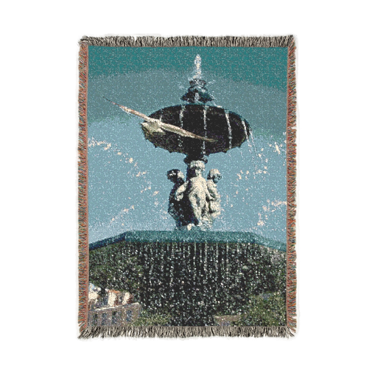 Woven blanket featuring seagull in flight with fountain in Lisbon in the background size: 52’’x37’’