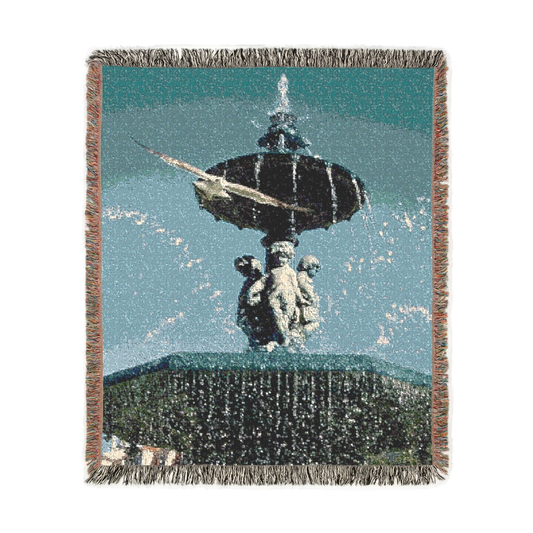 Woven blanket featuring seagull in flight with fountain in Lisbon in the background size: 60’’x50’’